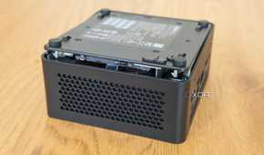 Asus NUC 14 Pro with the bottom cover lifted slightly from the chassis