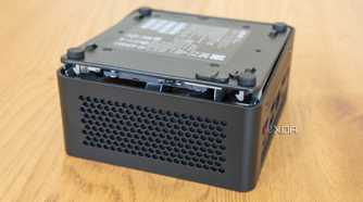 Asus NUC 14 Pro with the bottom cover lifted slightly from the chassis