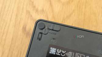 Close-up of the lock slider on the bottom of the Asus NUC 14 Pro