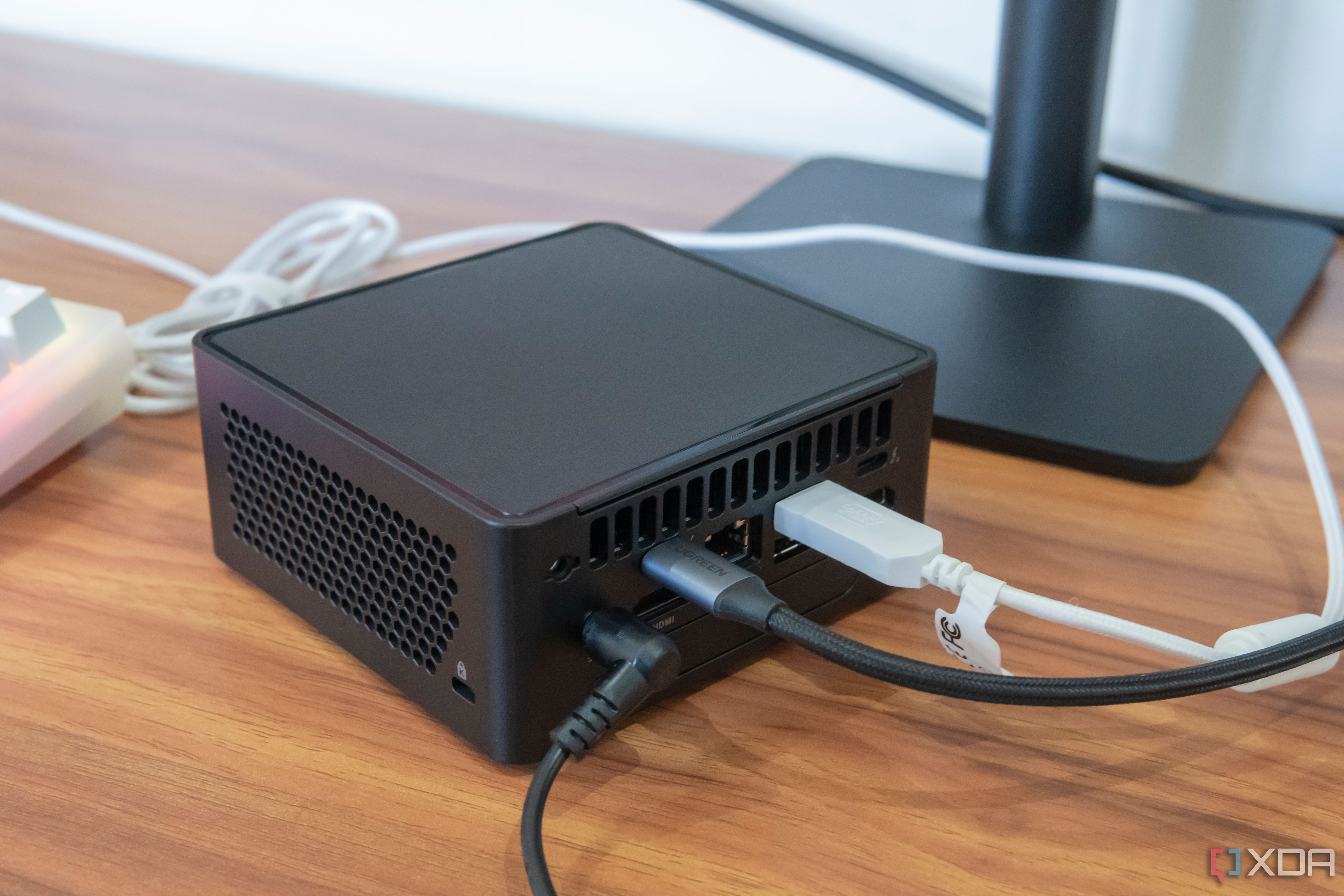 Angled rear view of thew Asus NUC 14 Pro with some peripherals connected
