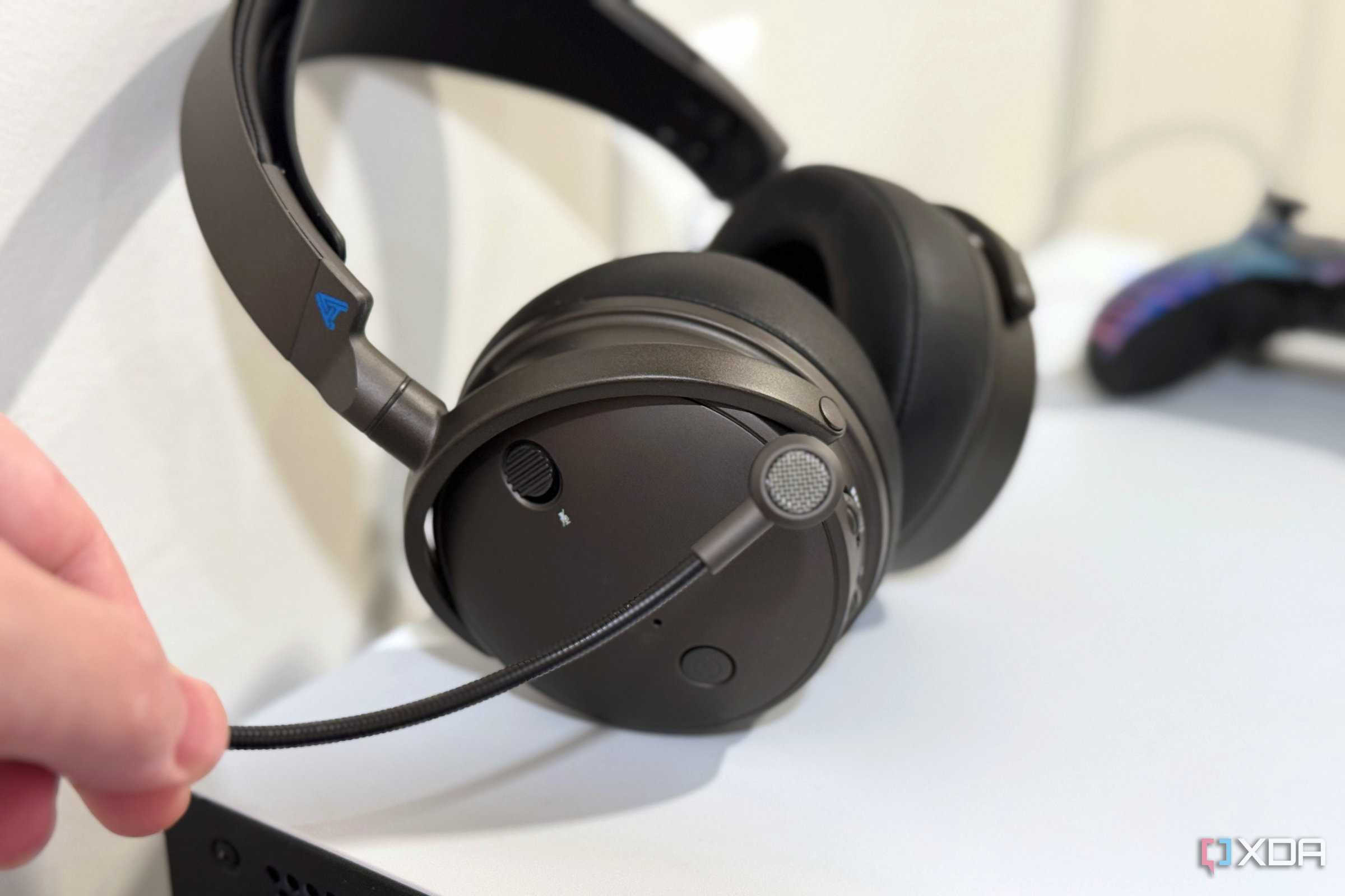 audeze maxwell boom mic held in front of the headset