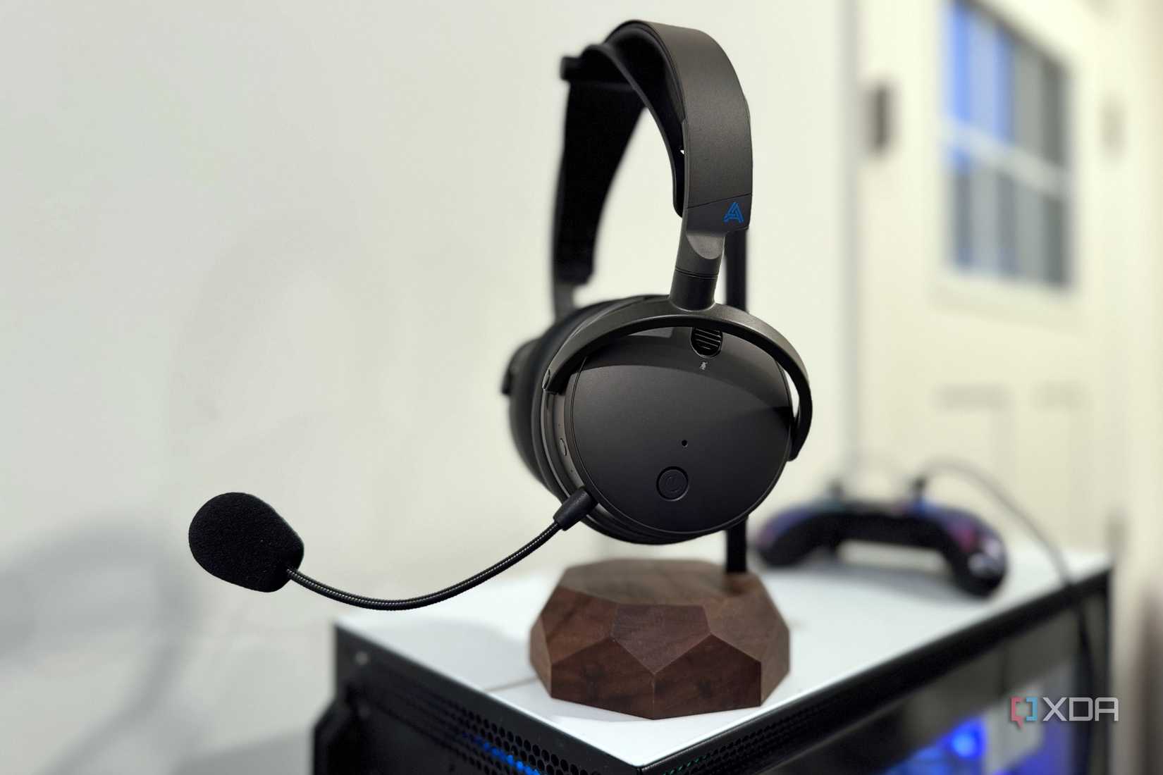 audeze maxwell headset on a headphone stand on top of a pc chassis