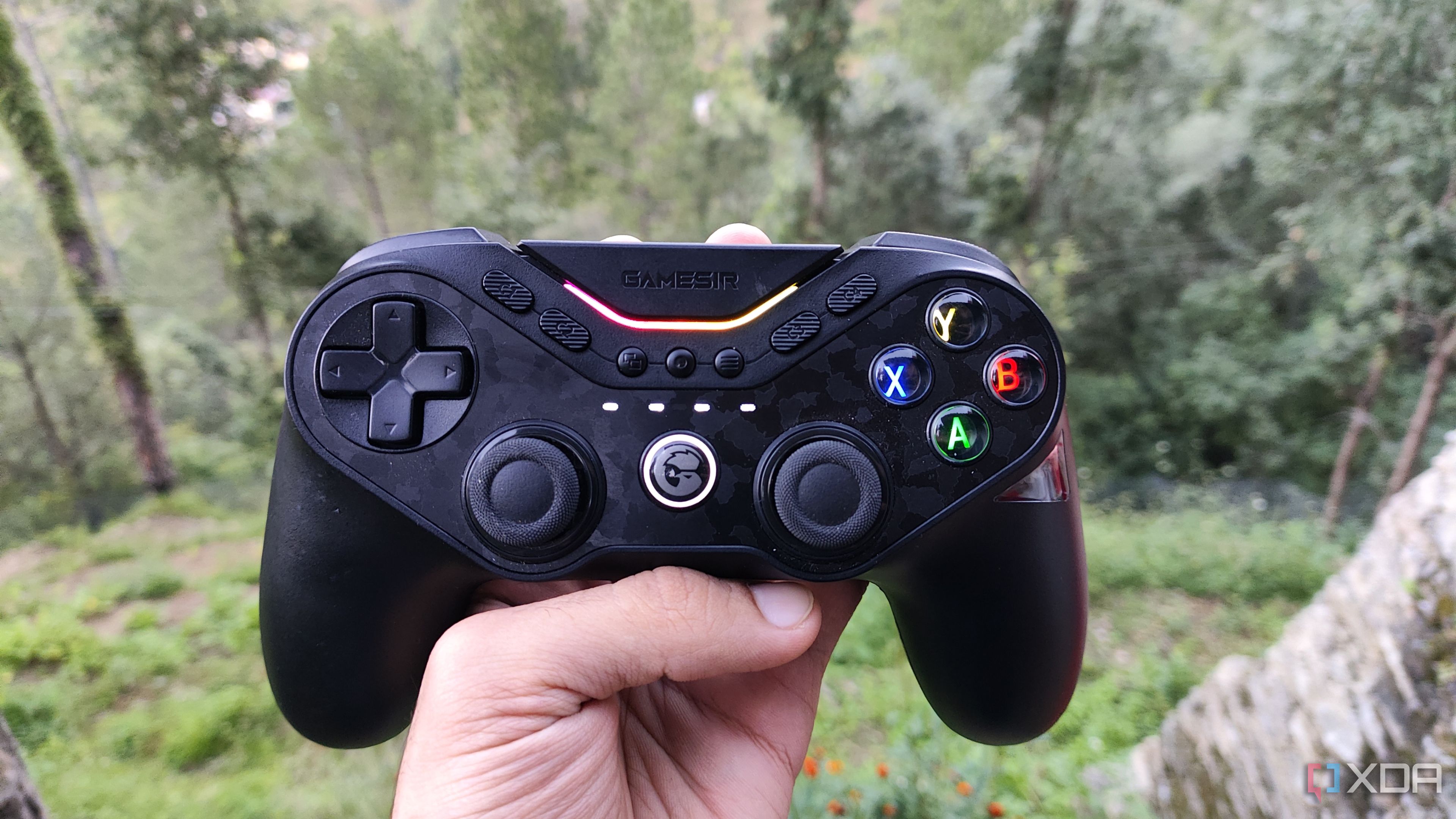 A person holding a GameSir Tarantula Pro controller
