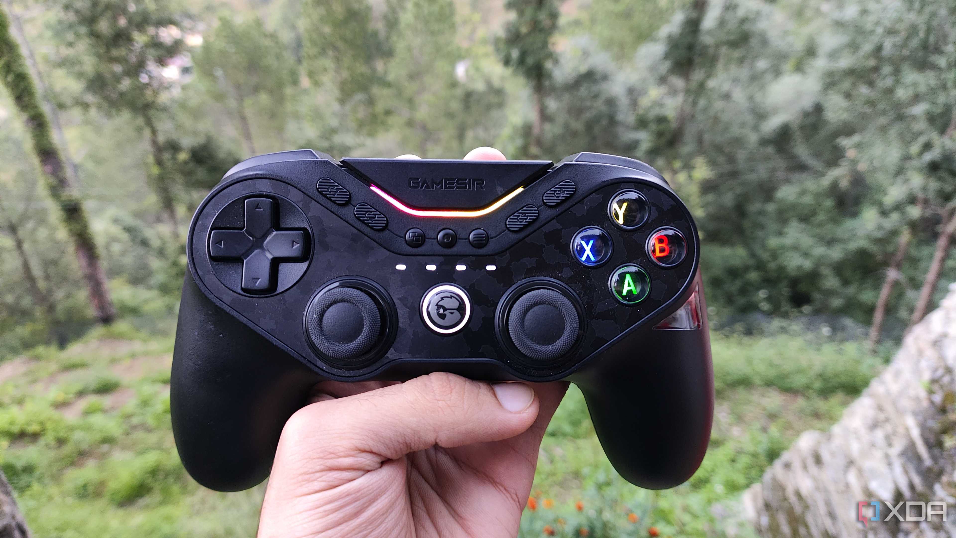 A person holding a GameSir Tarantula Pro controller