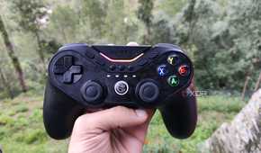 A person holding a GameSir Tarantula Pro controller