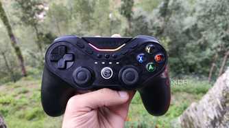 A person holding a GameSir Tarantula Pro controller