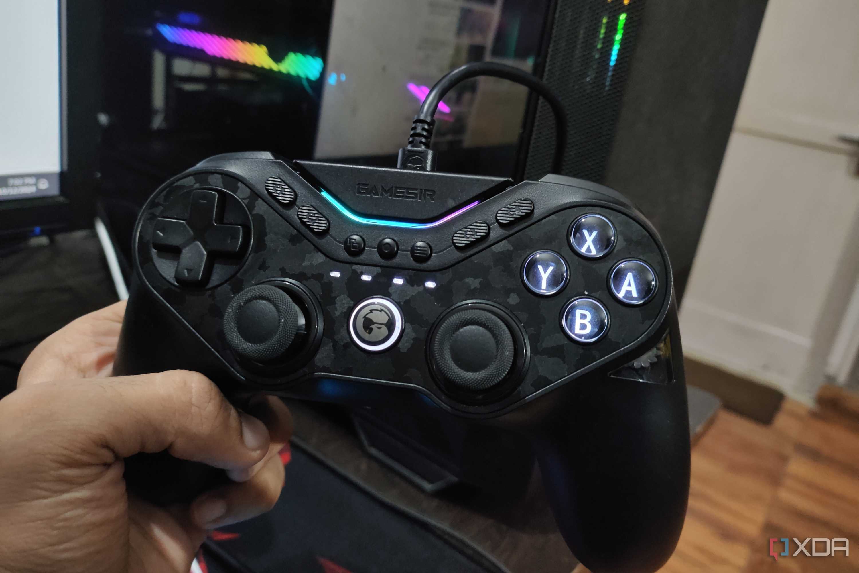 A person holding a GameSir Tarantula Pro controller