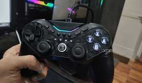 A person holding a GameSir Tarantula Pro controller