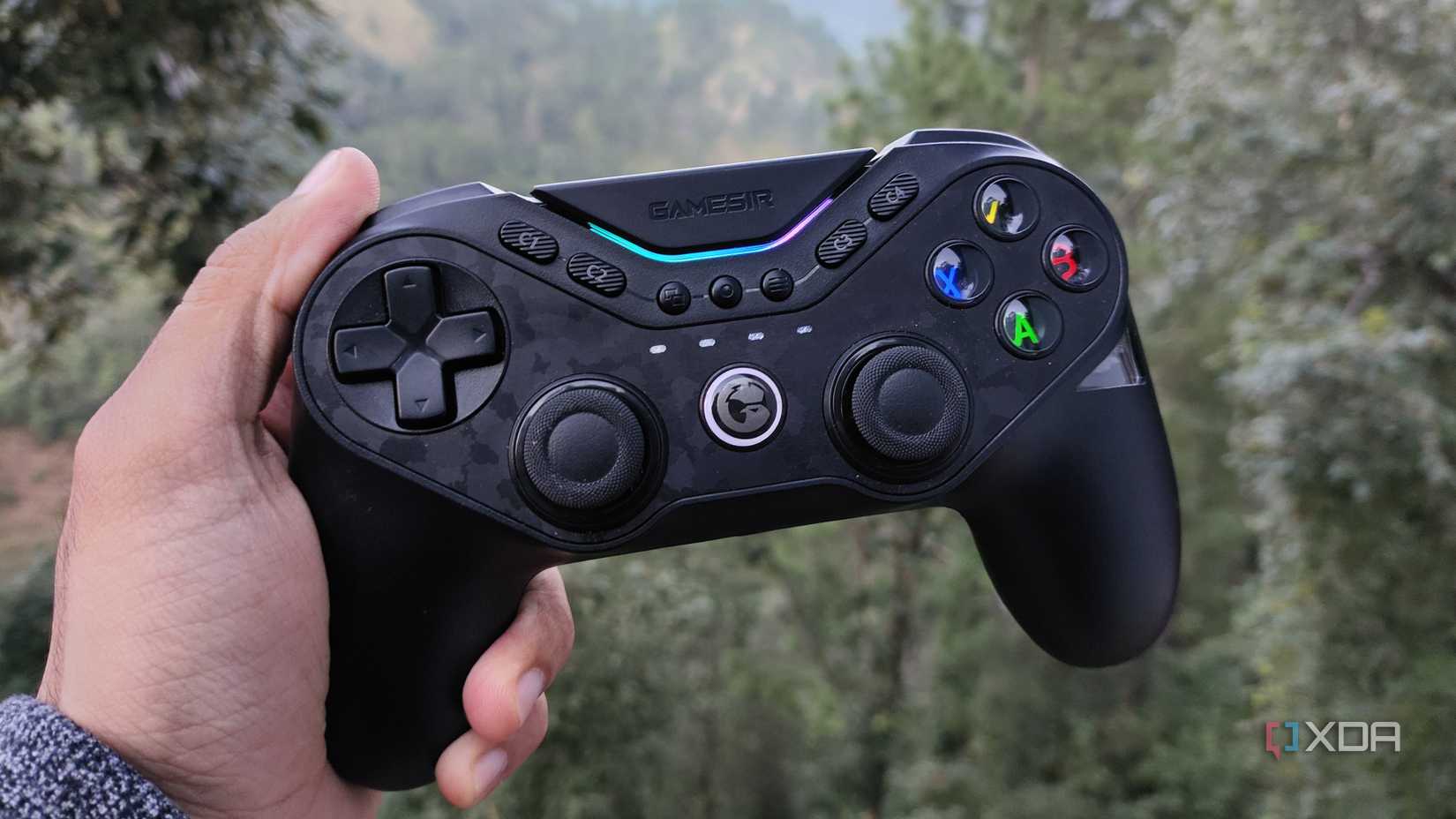 A person holding a GameSir Tarantula Pro controller