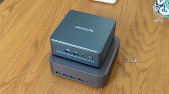 Angled view of the Geekom GT1 Mega with the Geekom Mini IT13 stacked on top of it