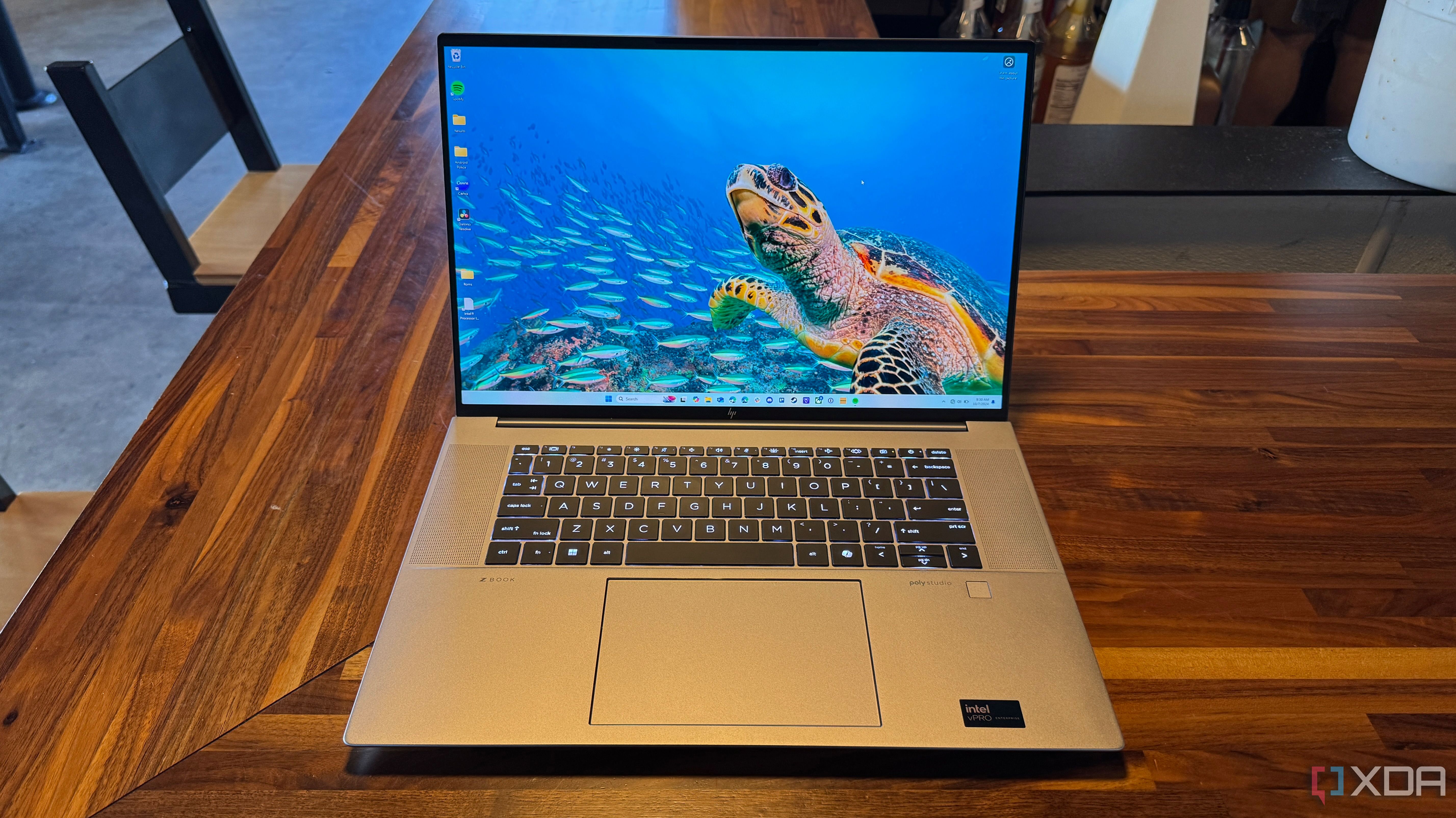 HP ZBook Studio G11 open on a wooden table