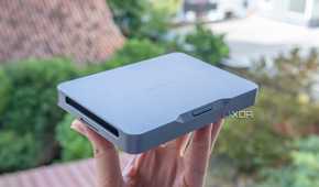 A Khadas Mind mini PC held in someone's hand
