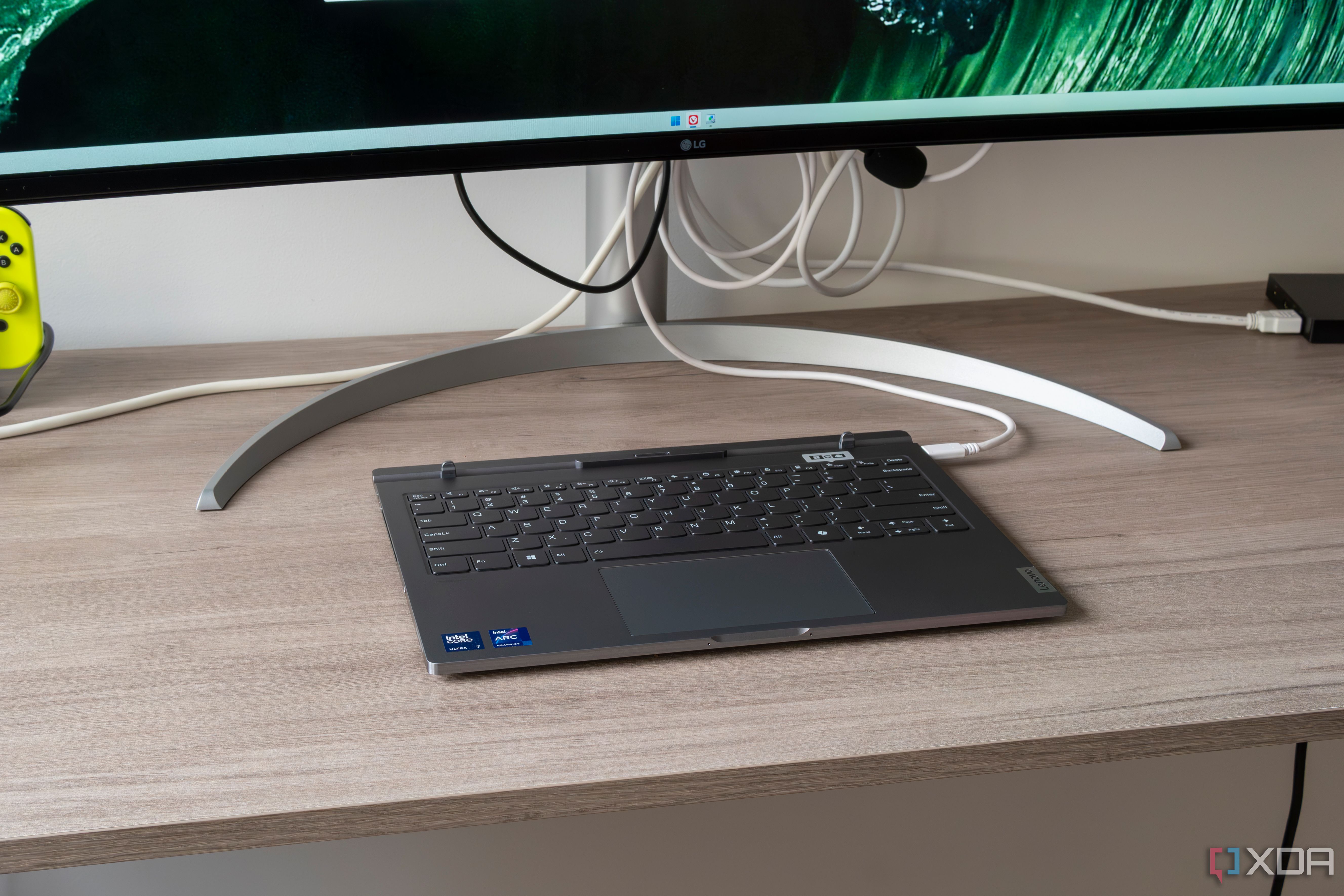 A Lenovo ThinkBook Plus Gen 5 Hybrid connected to a monitor to use as a desktop setup