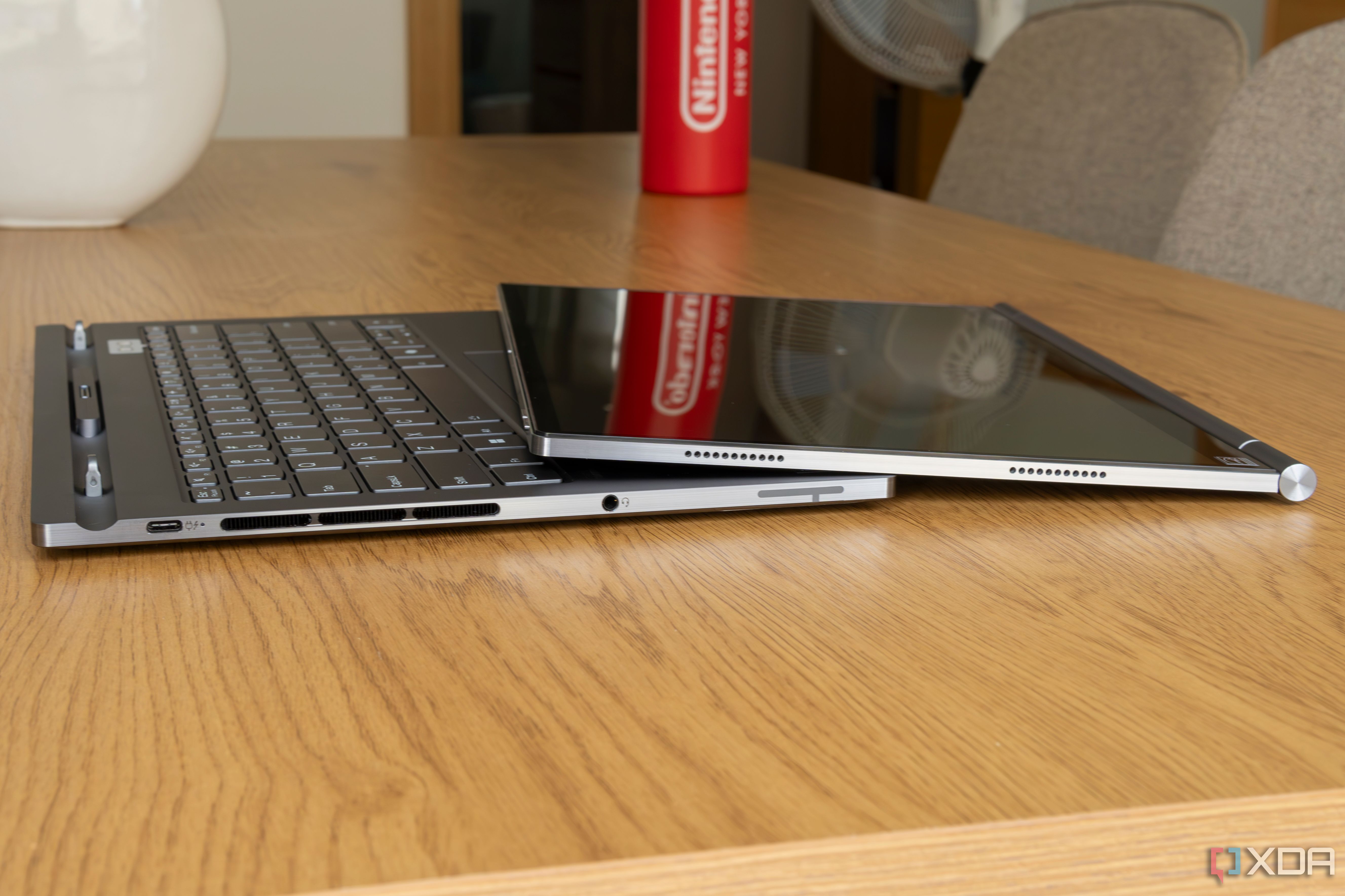 Side view Lenovo ThinkBook Plus Gen 5 Hybrid Station and Hybrid Tab detached from each other