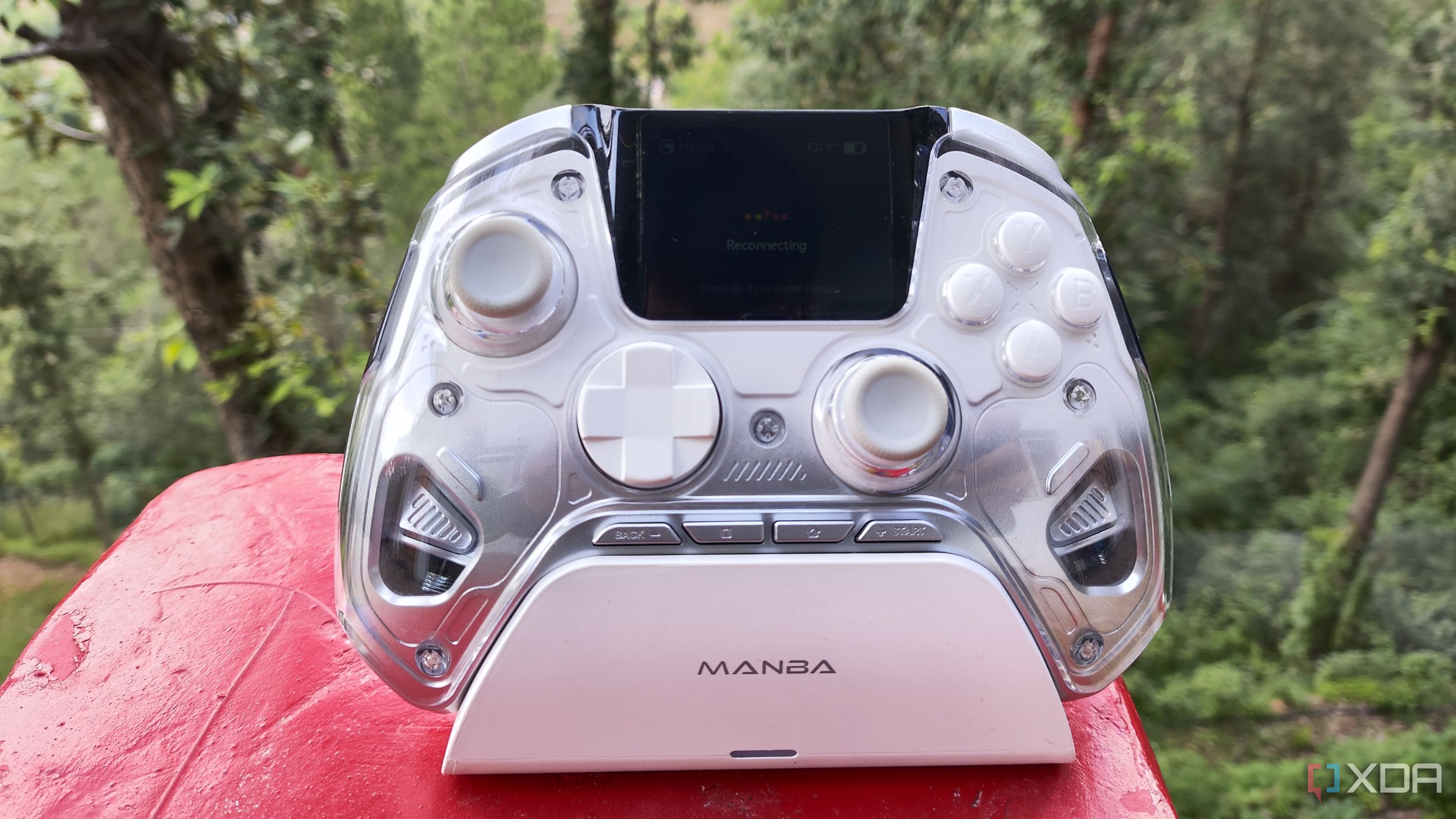 A Manba One controller resting on its charging dock