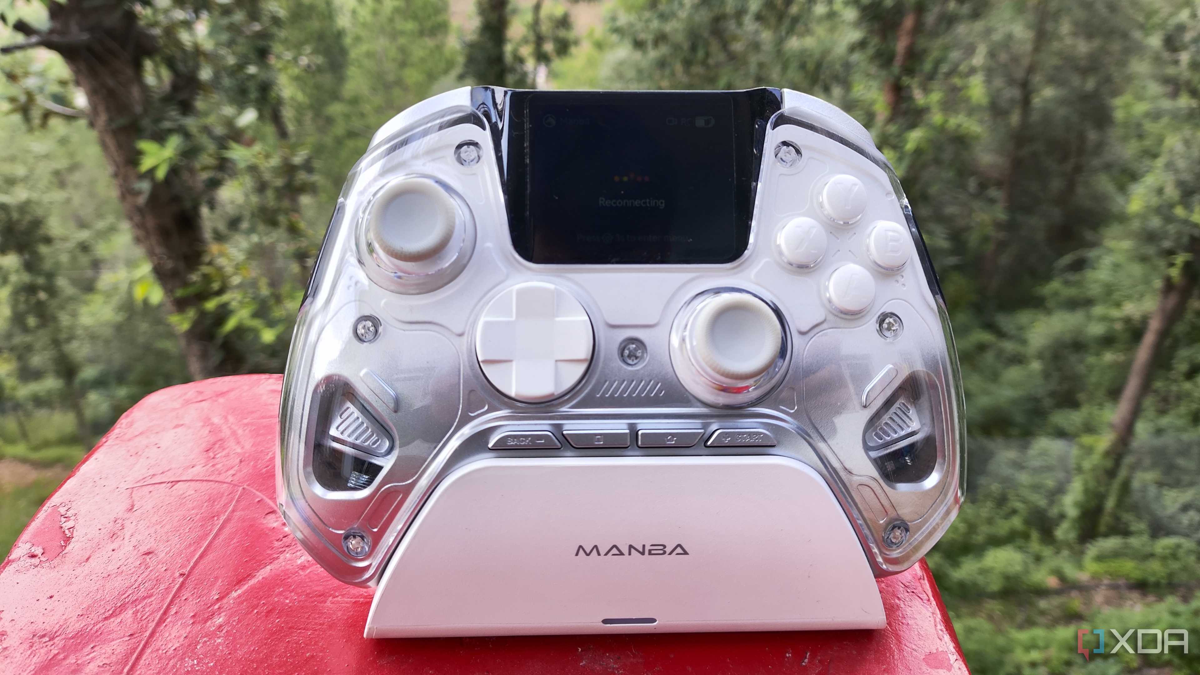 A Manba One controller resting on its charging dock