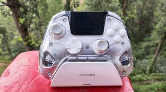A Manba One controller resting on its charging dock