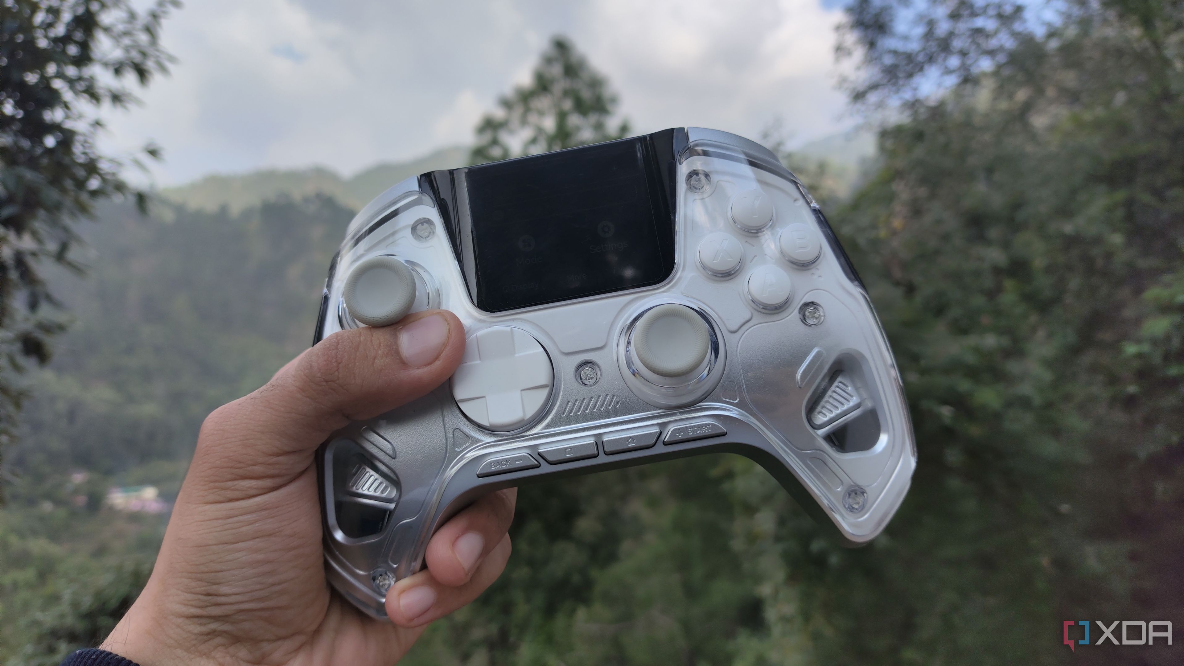 A person holding the Manba One controller