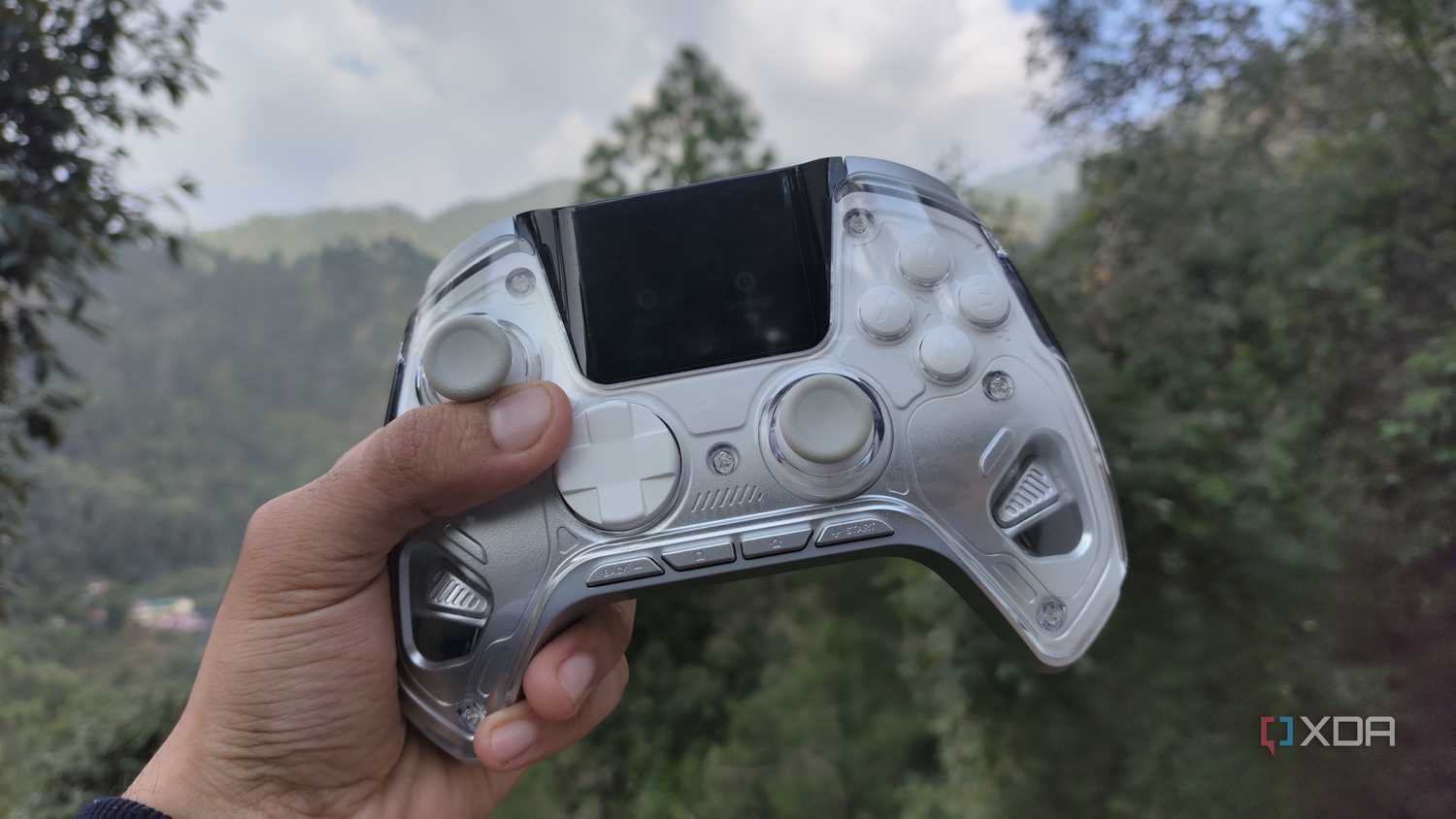 A person holding the Manba One controller