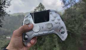 A person holding the Manba One controller
