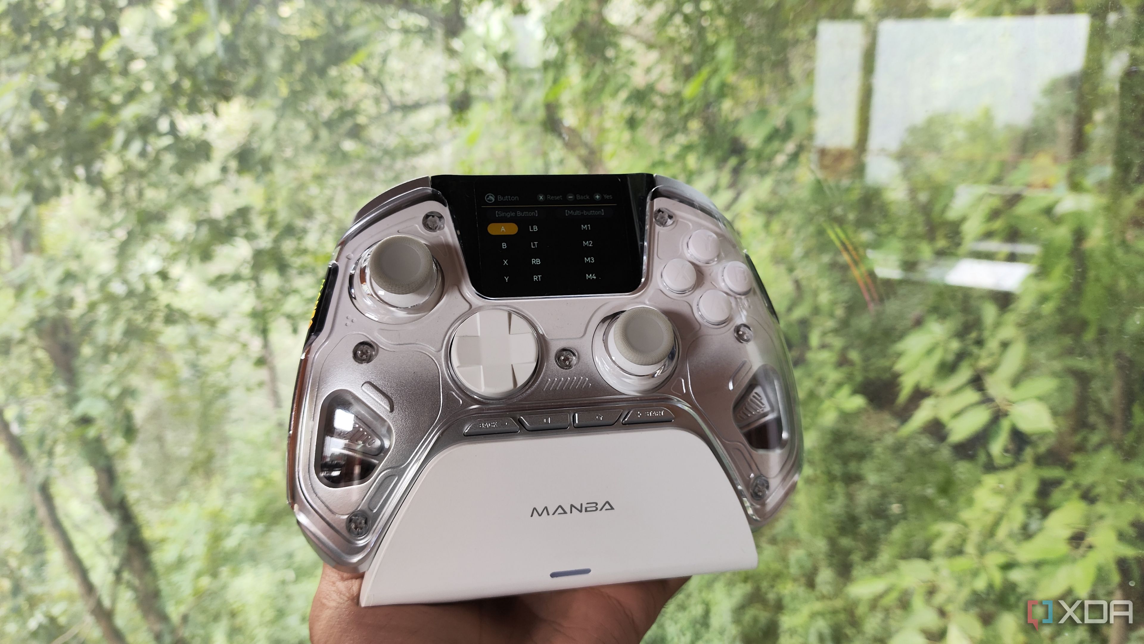 A Manba One controller resting on its charging dock
