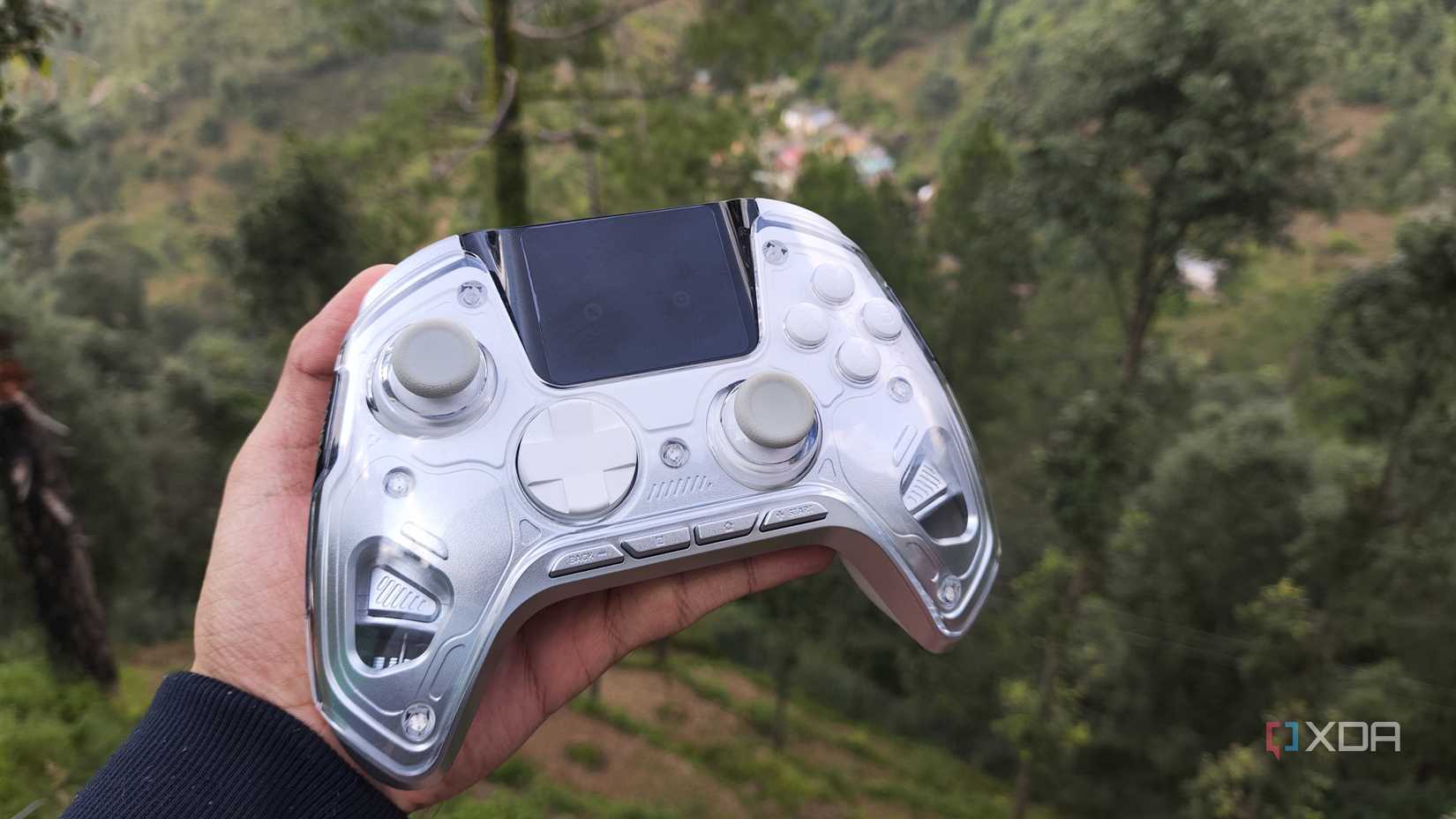A person holding the Manba One controller