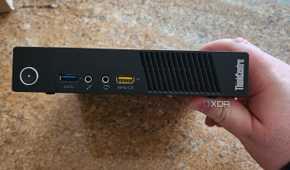 The front panel of a Lenovo mini PC.
