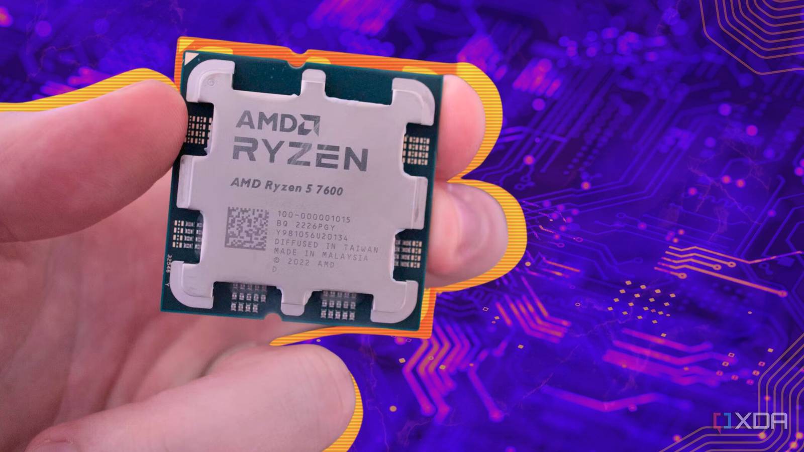 computer processor held in fingers over stylized circuit board