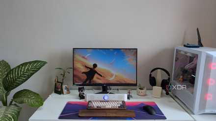 A PC setup showing a PC, monitor and desk with accessories