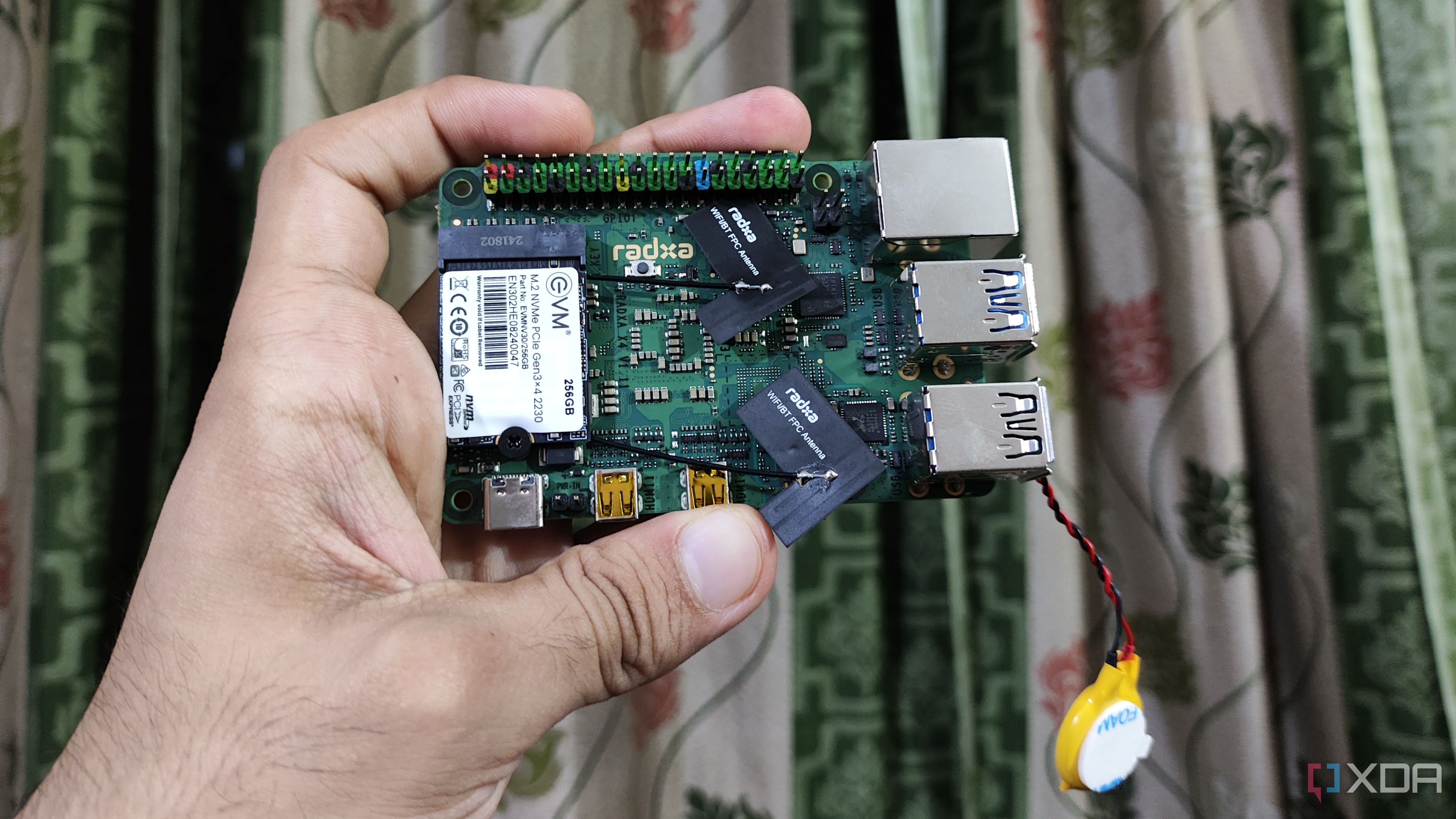 A person holding a Radxa X4 SBC