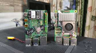 A Radxa X4 placed next to a Raspberry Pi 5