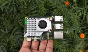 A person holding a Raspberry Pi 5