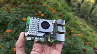 A person holding a Raspberry Pi 5