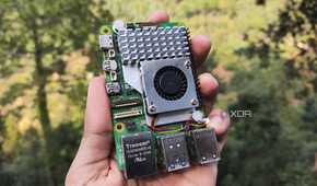 A person holding a Raspberry Pi 5