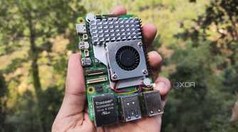 A person holding a Raspberry Pi 5