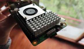 A person holding a Raspberry Pi 5