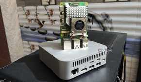 A Raspberry Pi 5 placed on top of an Aiffro K100 NAS