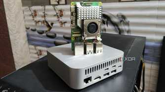 A Raspberry Pi 5 placed on top of an Aiffro K100 NAS