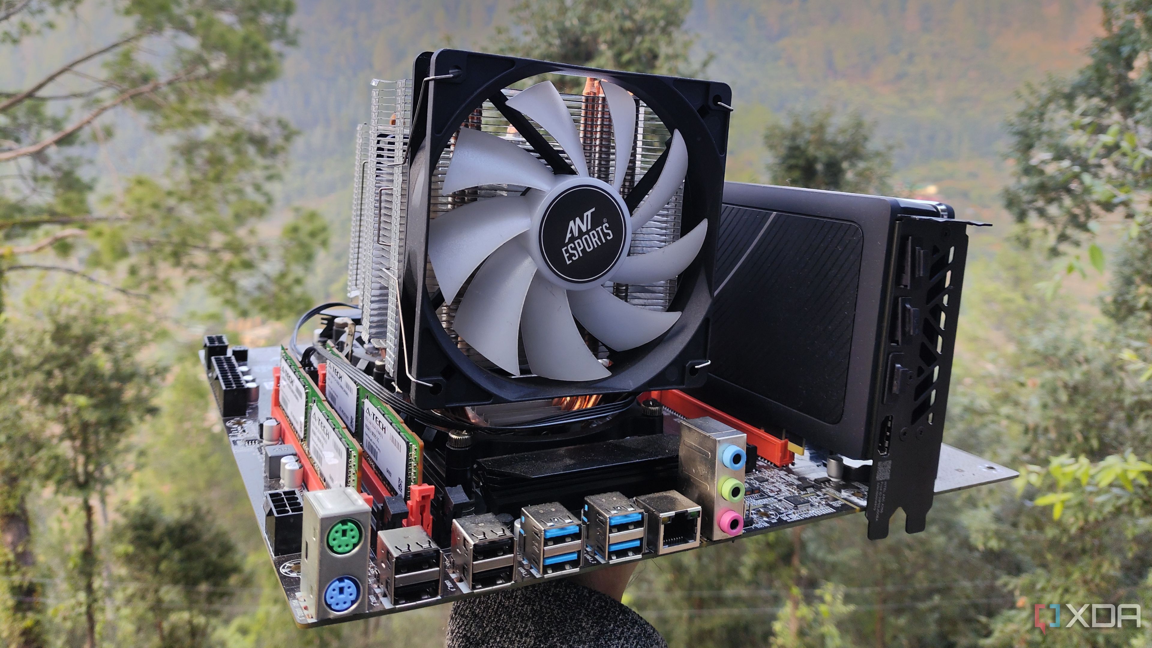 A person holding a dual-Xeon server motherboard