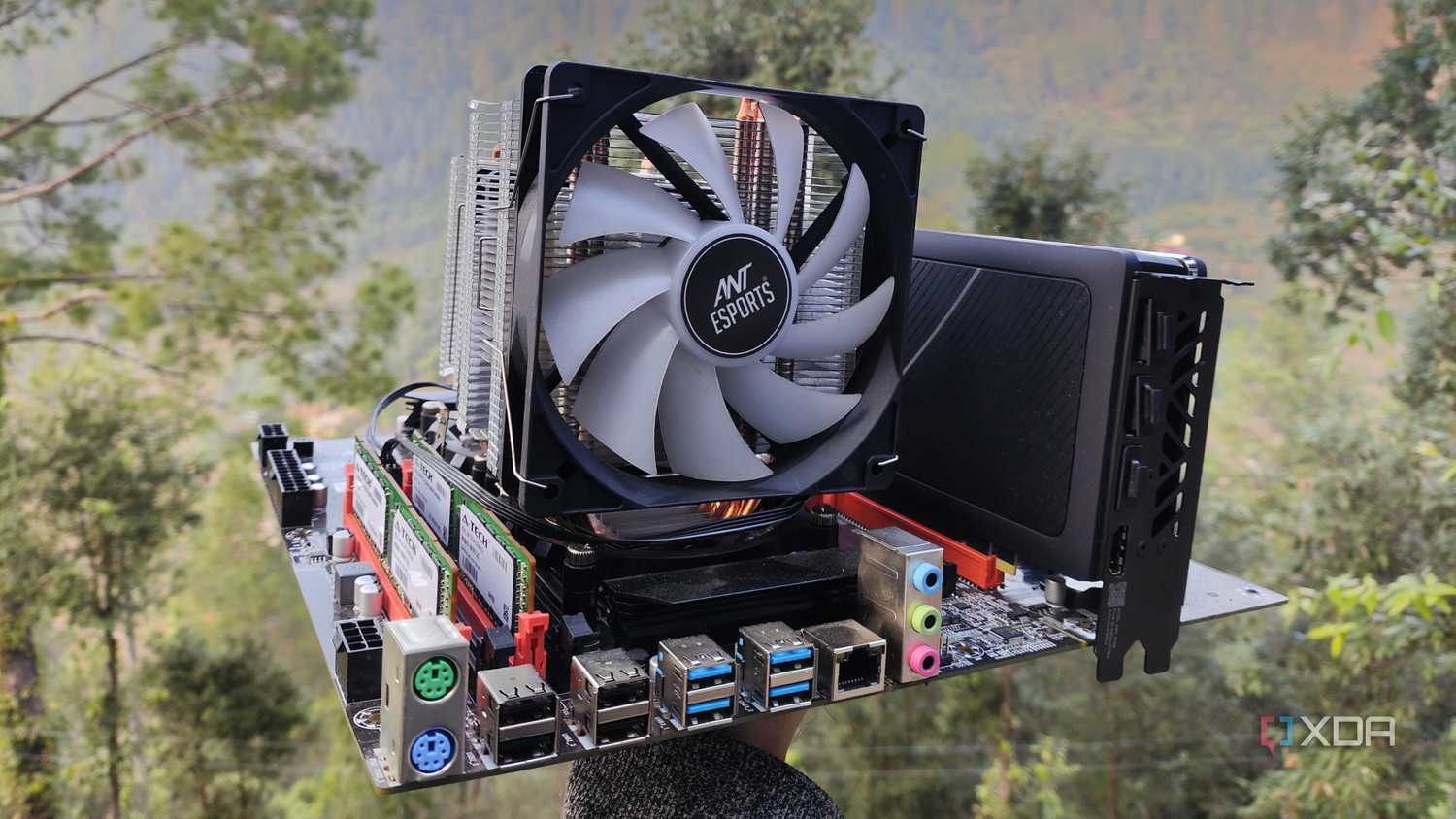 A person holding a dual-Xeon server motherboard