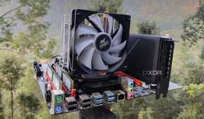 A person holding a dual-Xeon server motherboard