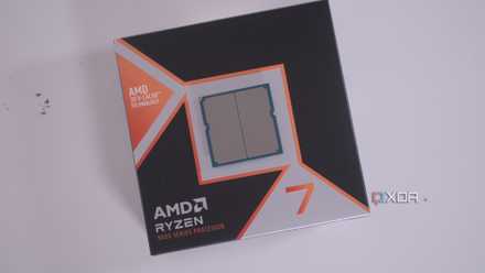 An AMD Ryzen 7 9800X3D in its box with its contact chips visible.