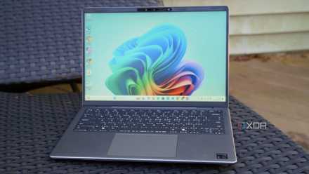 Dell Inspiron 14 laptop on an armchair.