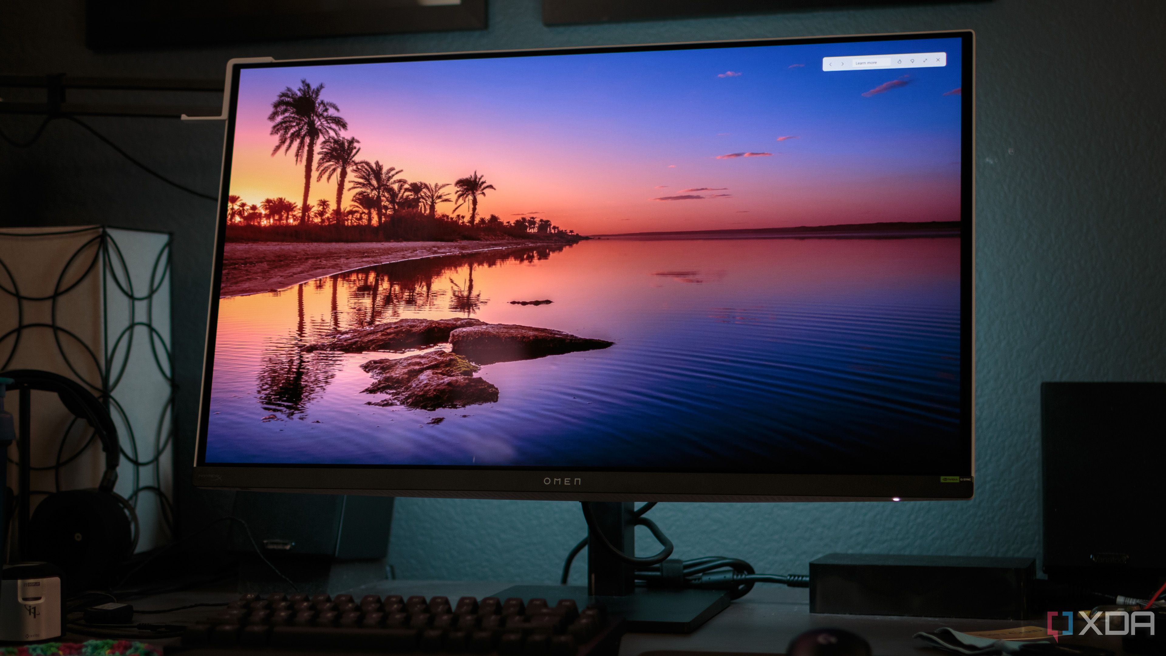 The front of the HP OMEN Transcend 32 OLED showing a wallpaper.