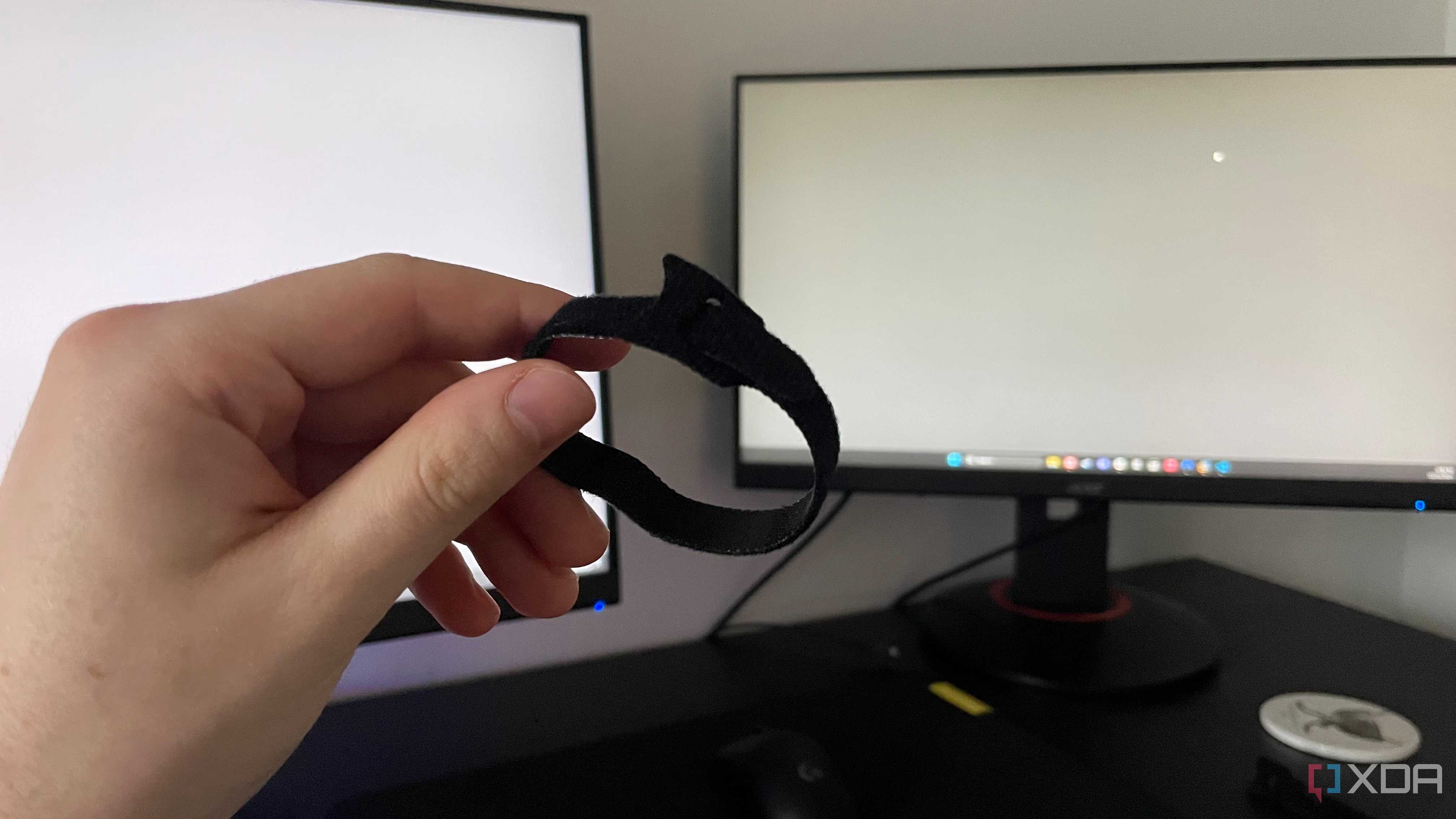 A photo of someone holding a cable tie
