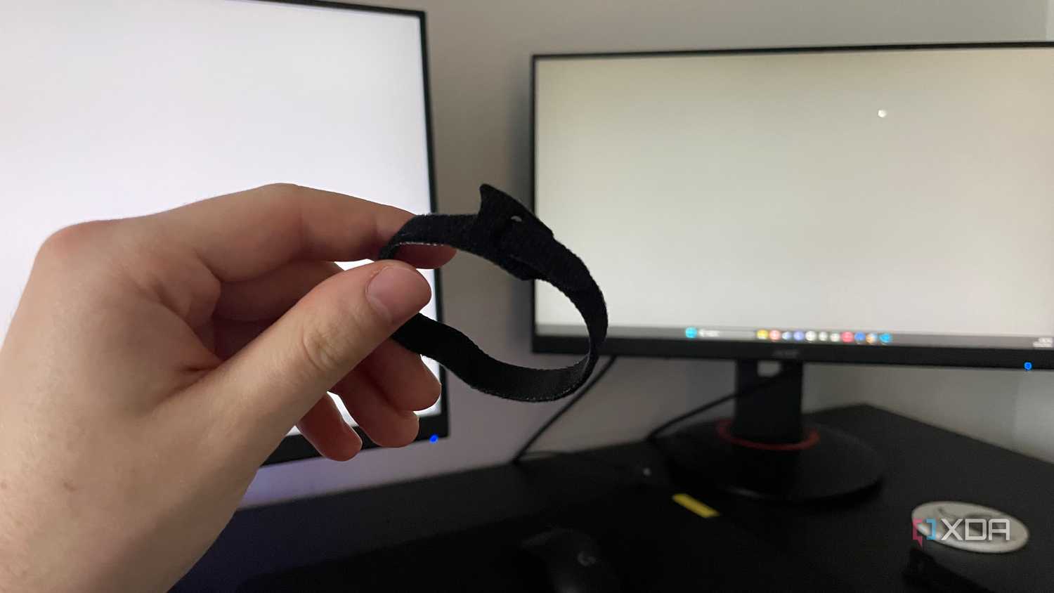 A photo of someone holding a cable tie