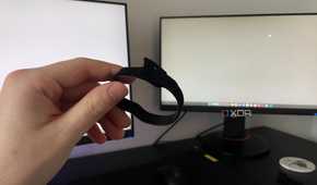 A photo of someone holding a cable tie