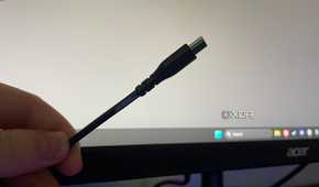 A USB-C cable marked with blue