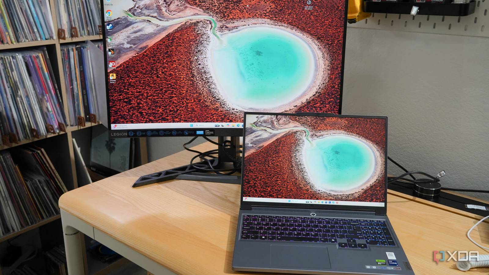 A Lenovo laptop connected to the Legion monitor.