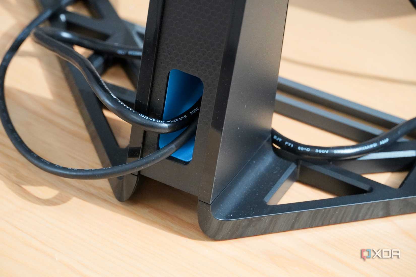 Cable management at the bottom of a Lenovo Legion monitor.